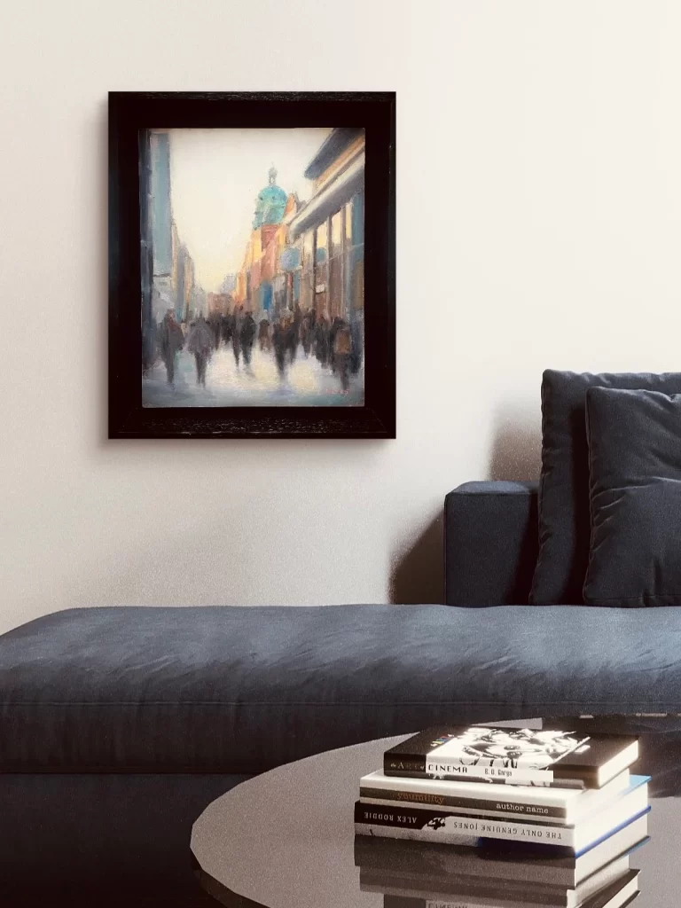 Henry Street  — atmospheric Dublin cityscape with figures and umbrellas, framed above a navy sofa, by Deirdre Hayes.